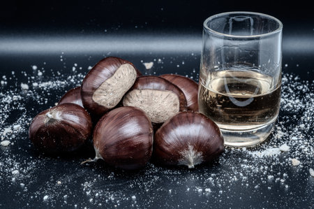 A composition of a typically autumnal fruit, such as the chestnut, which enhances its beauty and details.の写真素材
