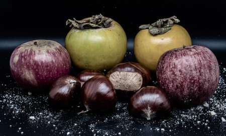 A composition of typically autumnal fruits such as chestnuts, persimmons or the Campanian Annurca...