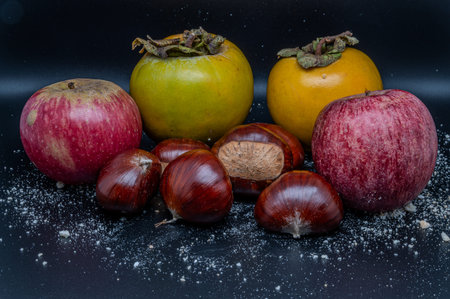 A composition of typically autumnal fruits such as chestnuts, persimmons or the Campanian Annurca...