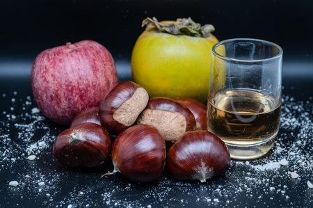 A composition of typically autumnal fruits such as chestnuts, persimmons or the Campanian Annurca apple, enhancing their beauty and detail.の写真素材