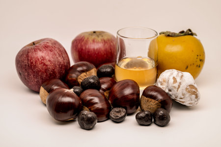 A composition of typically autumnal fruits such as chestnuts, persimmons or the Campanian Annurca...
