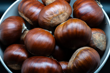 A composition of a typically autumnal fruit, such as the chestnut, which enhances its beauty and details.の写真素材