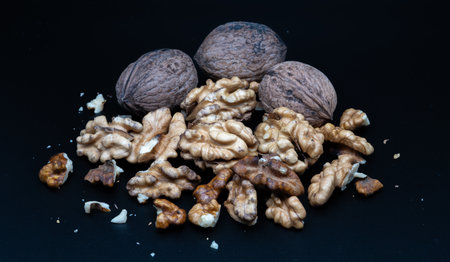 A composition of typically autumnal fruits such as walnuts, enhancing their beauty and detail.の写真素材