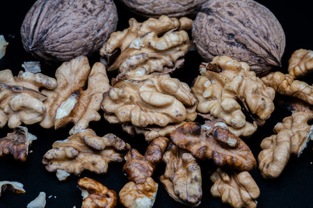 A composition of typically autumnal fruits such as walnuts, enhancing their beauty and detail.の写真素材