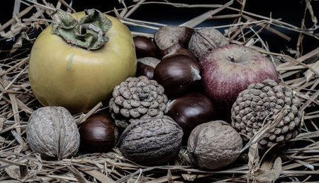 A composition of typically autumnal fruits such as chestnuts, walnuts, persimmons or the Annurca...