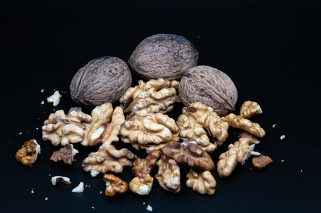 A composition of typically autumnal fruits such as walnuts, enhancing their beauty and detail.の写真素材