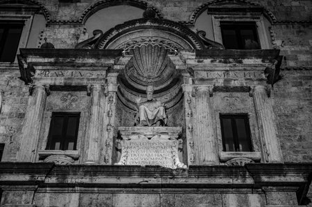 The Palazzo dei Capitani del Popolo is one of the best known historical buildings in Ascoli Piceno. With its medieval crenellated tower it rises next to the historic CaffÃ¨ Meletti.の写真素材