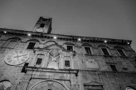 The Palazzo dei Capitani del Popolo is one of the best known historical buildings in Ascoli Piceno. With its medieval crenellated tower it rises next to the historic CaffÃ¨ Meletti.の写真素材