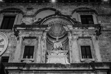 The Palazzo dei Capitani del Popolo is one of the best known historical buildings in Ascoli Piceno. With its medieval crenellated tower it rises next to the historic CaffÃ¨ Meletti.の写真素材