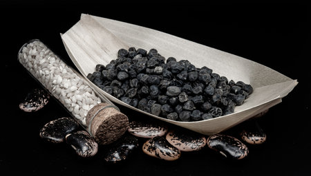 A composition of black chickpeas and rice, which enhances their beauty and detailsの写真素材