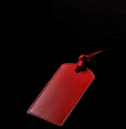 Black Friday. Red price tag sticker on a lace on a black background. Header banner mockup with copy space. AI generated.の素材