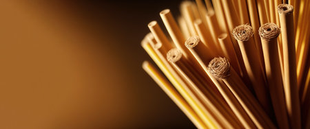 Bundle texture of fresh yellow straw from the field, close-up. Header banner mockup with copy space. AI generated.の素材