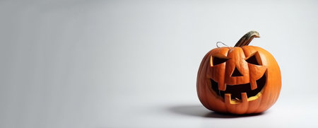 Halloween scary pumpkin with fire, white background. Header banner mockup with copy space. AI generated.の素材