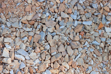 Crushed stone brown gray background texture, top view. Natural stone gravel. AI generated. Header banner mockup with copy space.の写真素材