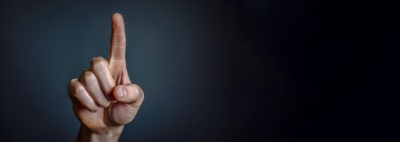 Index finger up, symbol of monotheism of the Muslim religion. Man black background. AI generated. Header banner mockup with copy space.の素材