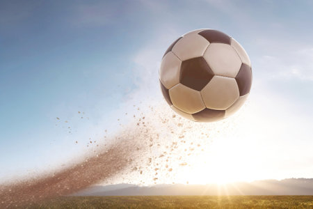 Soccer ball flies in the air from a kick, traces of trajectory, Dark background isolate. Header banner mockup with copy space.の素材