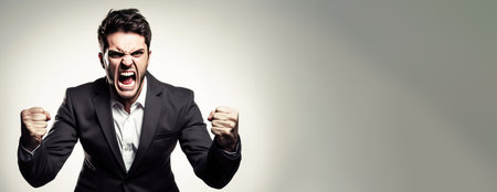Close-up of a male politician in a suit, emotionally annoyed angry, gray background isolate. Header banner mockup with copy space.の素材