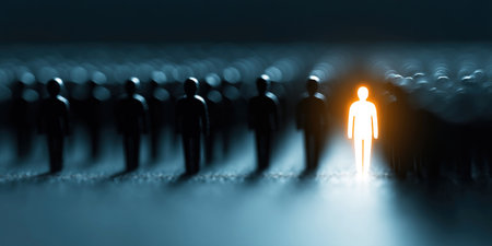 In a darkened environment an individual stands out in bright light while surrounded by a crowd of shadowy figures.の素材