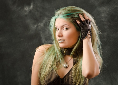 Photosession of the pretty young blonde girl in the steampunk styleの写真素材