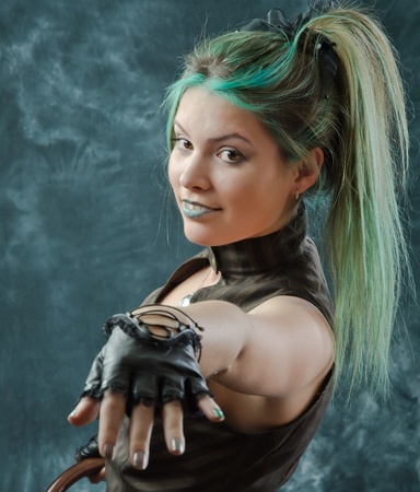 Photosession of the pretty young blonde girl in the steampunk styleの写真素材
