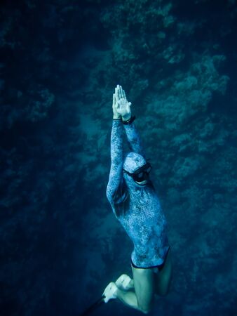 Freediver rises up from the depth of the Blue Hole in Dahab, Egyptの写真素材