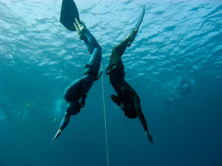 Two freedivers make simultaneous dive in Bue Hole. Dahab, Egypt