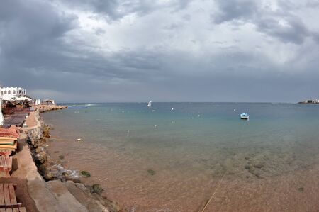 The Dahab gulf, surf and unusual clouds at the skyの写真素材