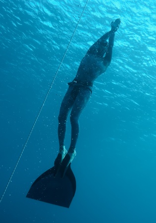 The freediver returns to the surface from the deep dive in Blue Hole, Dahab. Egyptの写真素材