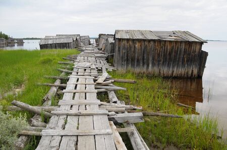 The picture shows abandoned and broken slip docs in a small settlement in Russia's Karelia regionの写真素材