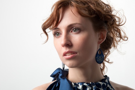 Close up view of the pretty young woman. It looks like she remembers something in the past.の写真素材