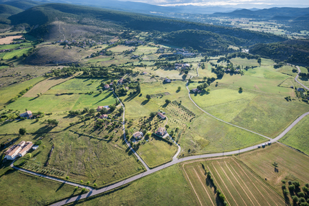 Birds eye view of the cultivated land, roads and private houses of Provenceの写真素材
