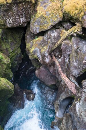 Eroded fancy rock formations at the Chasm Viewing Bridge at Milford Sound, New Zealandの写真素材