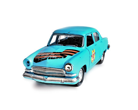 The toy car on a white background. Close up. Blue color. Metal. Model. An inscription on a car...
