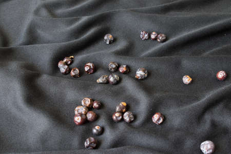 Black berries on black materialの写真素材