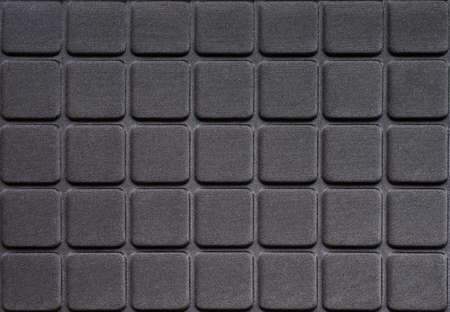 Rows of black squares on a black backgroundの写真素材