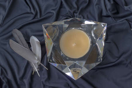 Occultism symbolic objects, human figures, bird feathers, candleの写真素材