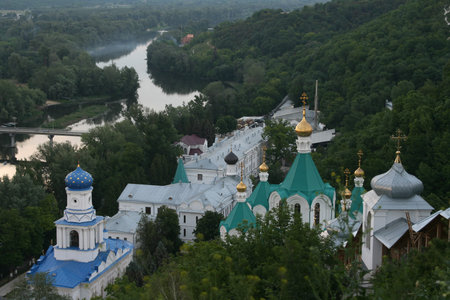 orthodox cathedral, church, the temple on a hill slope at the river