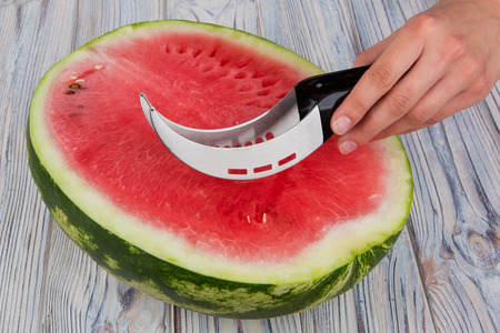 Special knife for fast and convenient cutting of watermelonの写真素材