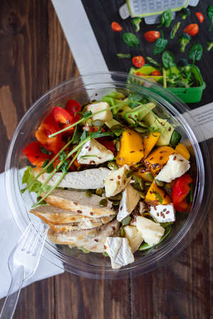 Fresh salad with chicken breast, arugula and tomatoの写真素材