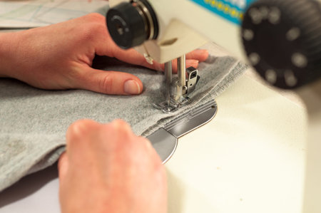 processes of sewing on the sewing machine sew women's hands sewing machine