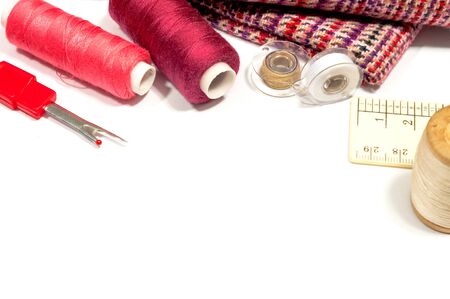 various sewing supplies on a white background with space for textの写真素材