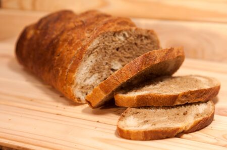 marble sliced ??wheat - rye bread on a wooden boardの写真素材