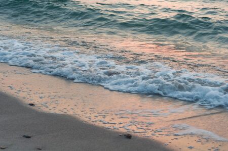 sea waves coming to the sandy beachの写真素材