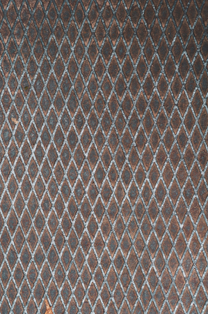 vertical background of the old sheet of metal with a diamond-shaped textureの写真素材
