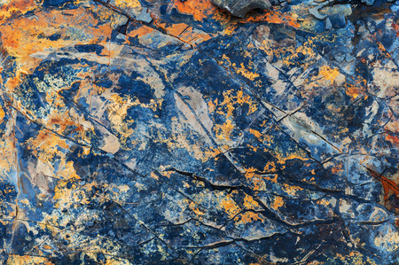 Background from a wild stone, iridescent sandstone close upの写真素材