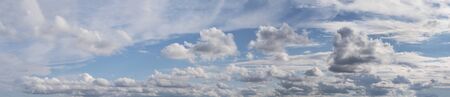 Beautiful white-lead clouds on blue sky. Outdoors. Horizontal panorama sky with different clouds.の写真素材