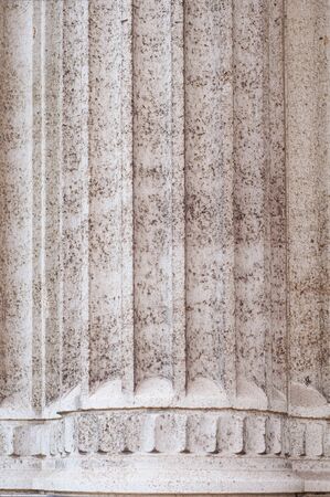 Antique stone pillar in renaissance architecture close-up. Marble natural material.の写真素材