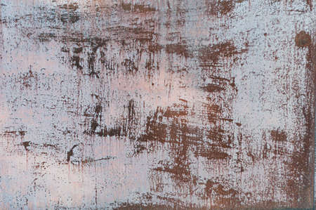 Rusty metal background close-up with old, peeling cracked paint, atmospheric impact, outdoors, horizontal photo.の写真素材