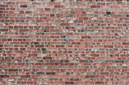 Old wall red bricks, rough masonry with concrete seams, rough surface, retro background for advertising banner, horizontal photoの写真素材
