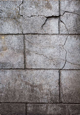 Old wall with cracks, smooth rough surface, rough plaster, horizontal close-up photo.の写真素材